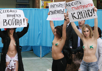 Участницы женского движения FEMEN на избирательном участке в Киеве Акция движения FEMEN в день выборов президента Украины
