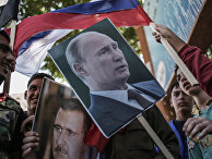 Участники митинга в поддержку президента Сирии Башара Асада и президента России Владимира Путин в Латакии. 2013 год.