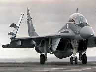 Многоцелевой истребитель МиГ-29 ВКС РФ перед взлетом с палубы тяжёлого авианесущего крейсера «Адмирал Кузнецов» Многоцелевой истребитель МиГ-29 ВКС РФ перед взлетом с палубы тяжёлого авианесущего крейсера «Адмирал Кузнецов»