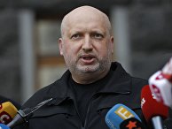 Секретарь Совета национальной безопасности и обороны Украины Александр Турчинов выступает перед СМИ в Киеве Секретарь Совета национальной безопасности и обороны Украины Александр Турчинов выступает перед СМИ в Киеве