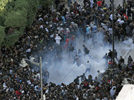 Столкновение во время акции протеста в Тунисе 14 января 2011 года