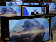 Владимир Путин на экране телевизора в магазине Владимир Путин на экране телевизора в магазине