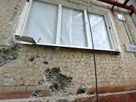 Жилой дом, пострадавший в результате обстрела, в поселке Горловка Донецкой области Жилой дом, пострадавший в результате обстрела, в поселке Горловка Донецкой области