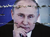 Разорванный плакат с изображением президента России Владимира Путина в Митровице, Сербия Разорванный плакат с изображением президента России Владимира Путина в Митровице, Сербия