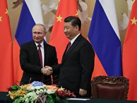 Президент РФ Владимир Путин и председатель КНР Си Цзиньпин на церемонии подписания совместных документов по итогам российско-китайских переговоров в Пекине. 8 июня 2018