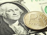 Монета номиналом один рубль на банкноте один доллар США