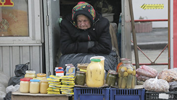 An elderly woman is trading in Kiev