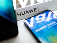 Логотип Huawei в розничном магазине в Пекине Логотип Huawei в розничном магазине в Пекине