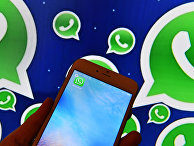 Иконка мессенджера WhatsApp на экране смартфона Иконка мессенджера WhatsApp на экране смартфона