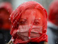 Участница акции протеста против домашнего насилия в Бухаресте Участница акции протеста против домашнего насилия в Бухаресте