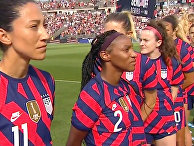 Members of the U.S. Women’s Soccer Team turned backs as 98-year-old World War II veteran Pete DuPré Members of the U.S. Women’s Soccer Team turned backs as 98-year-old World War II veteran Pete DuPré